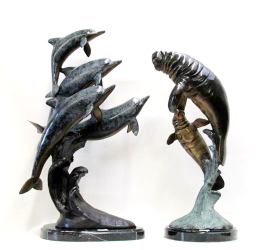 Appraisal: TWO MARINE WILDLIFE BRONZE SCULPTURES a marbleized polychrome enamel dolphin