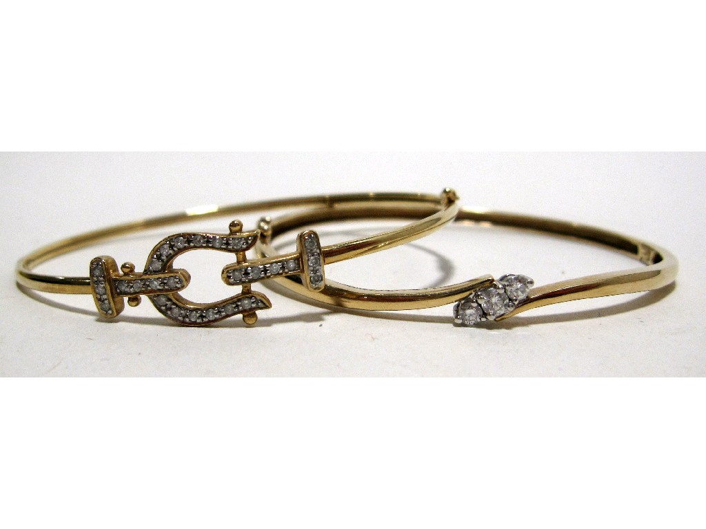 Appraisal: Lot comprising ct gold diamond three stone twist bangle and