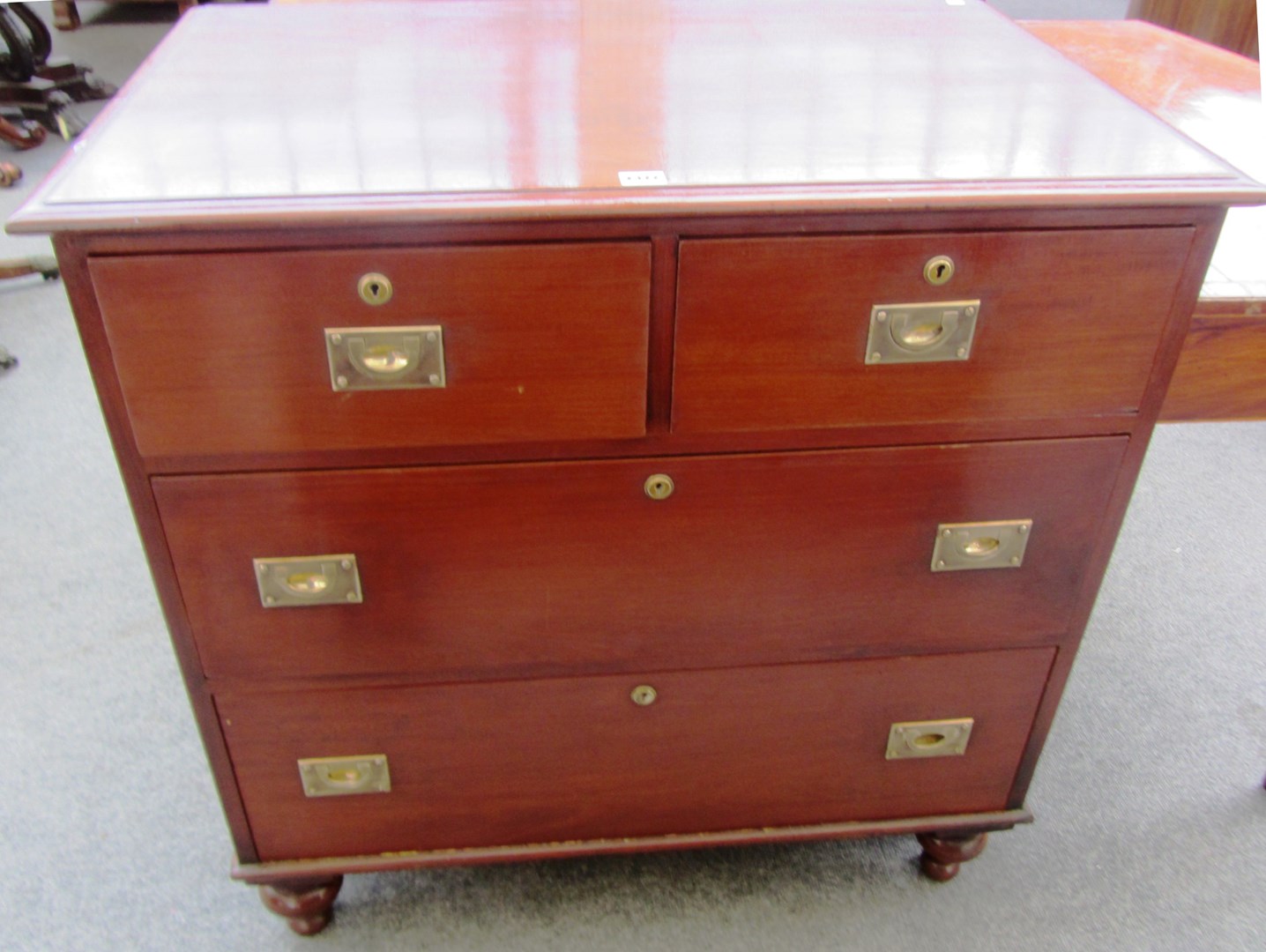 Appraisal: A mahogany campaign style chest of two short and two