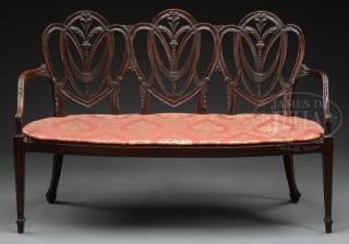 Appraisal: CARVED MAHOGANY -SHIELD BACK SETTEE This late th century copy