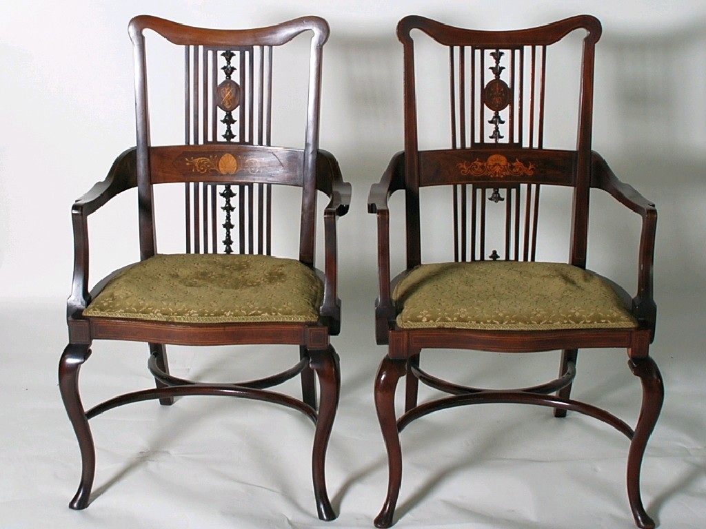 Appraisal: PAIR OF EDWARDIAN INLAID MAHOGANY DRAWING ROOM OPEN ARMCHAIRS the