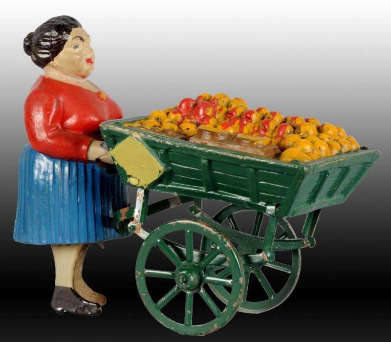 Appraisal: French Composition Tin Woman Fruit Peddler Toy Description Wind-up working