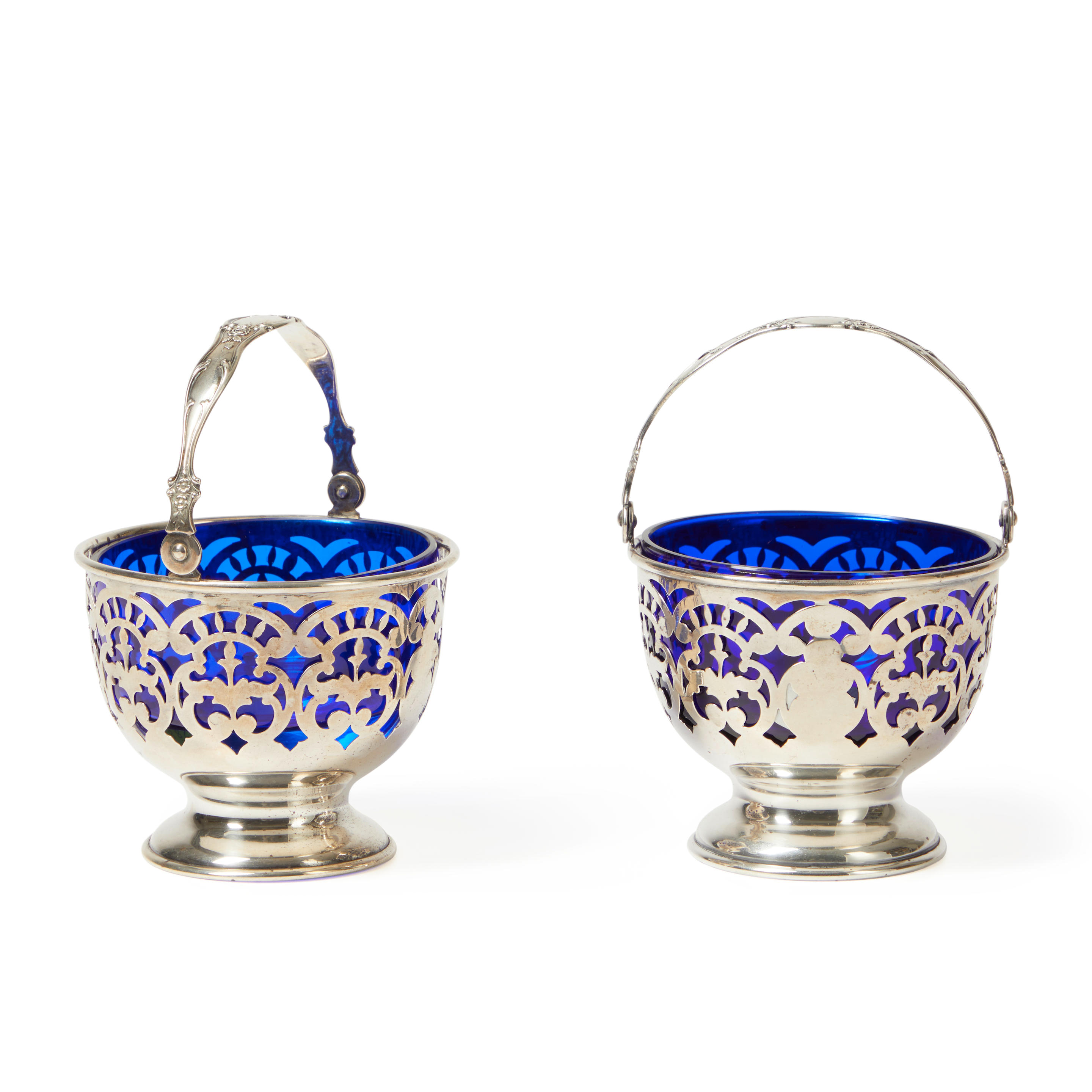 Appraisal: Pair of Sterling Silver Reticulated Baskets with Cobalt Glass Liners