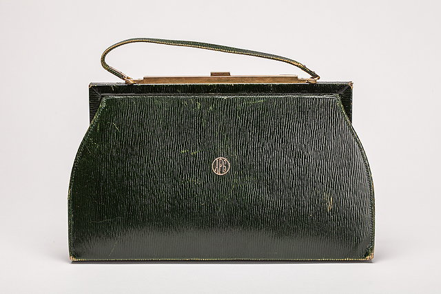 Appraisal: A s green leather Asprey handbag with fitted silver implements