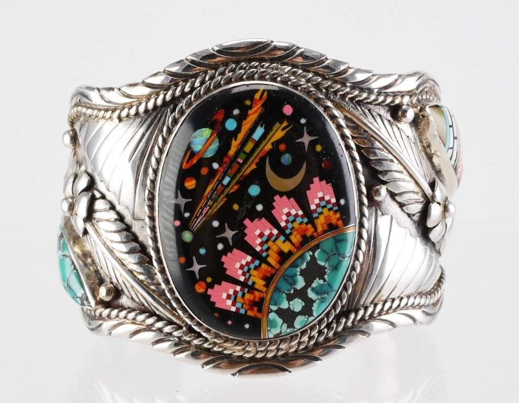 Appraisal: Sterling silver cuff bracelet featuring Native American style cosmic or