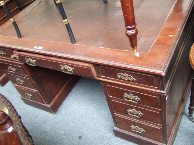 Appraisal: A late th century mahogany pedestal desk with nine drawers