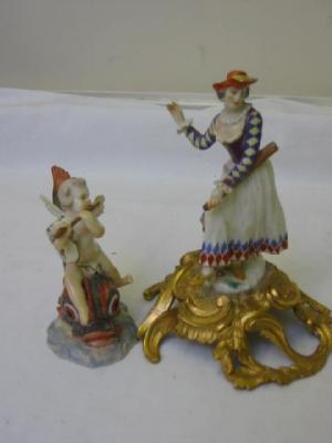 Appraisal: A MEISSEN PORCELAIN FIGURE of a Putto depicted playing a