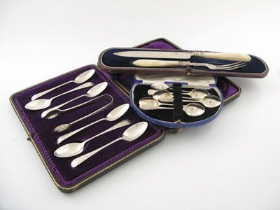 Appraisal: Three cased sets a cake knife and fork with mother