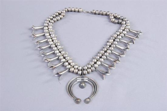 Appraisal: NAVAJO HAND-WROUGHT STERLING SILVER SQUASH BLOSSOM NECKLACE Circa s signed