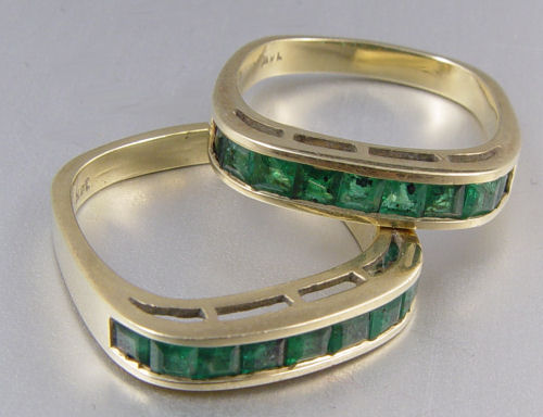 Appraisal: TWIN PAIR OF K CTW EMERALD BANDS Two K yellow