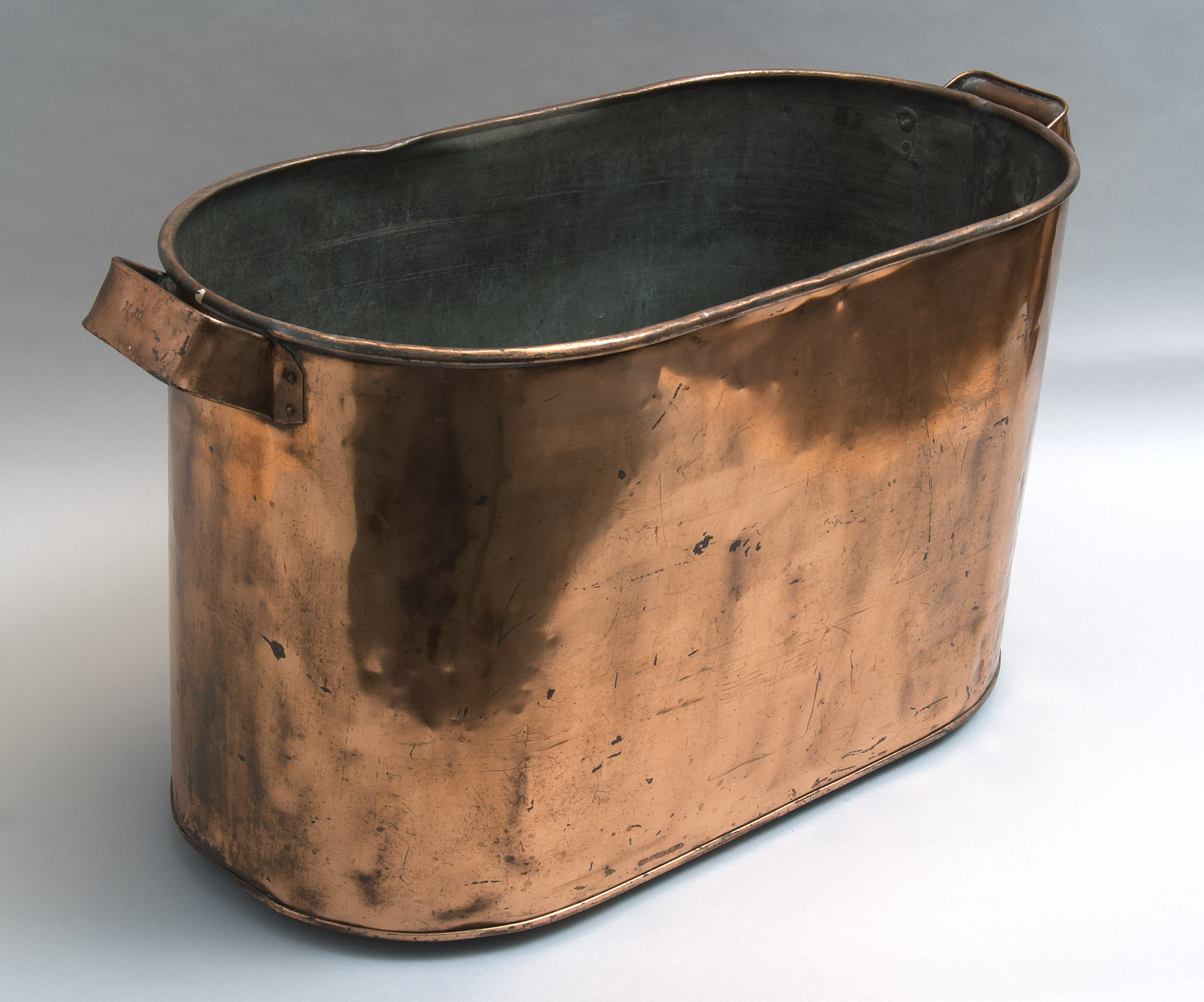 Appraisal: ANTIQUE COPPER BUCKET In oval form with applied copper carrying