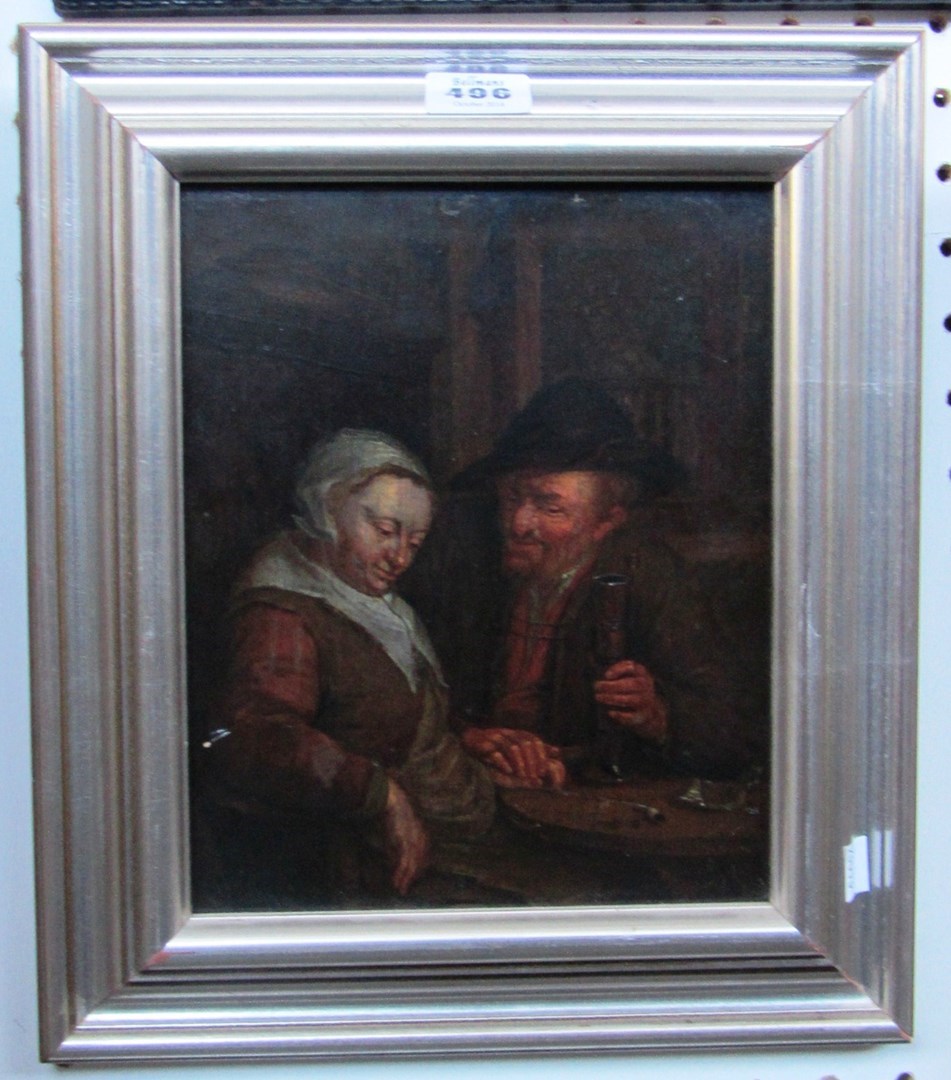 Appraisal: Follower of Adriaen van Ostade An elderly couple drinking in