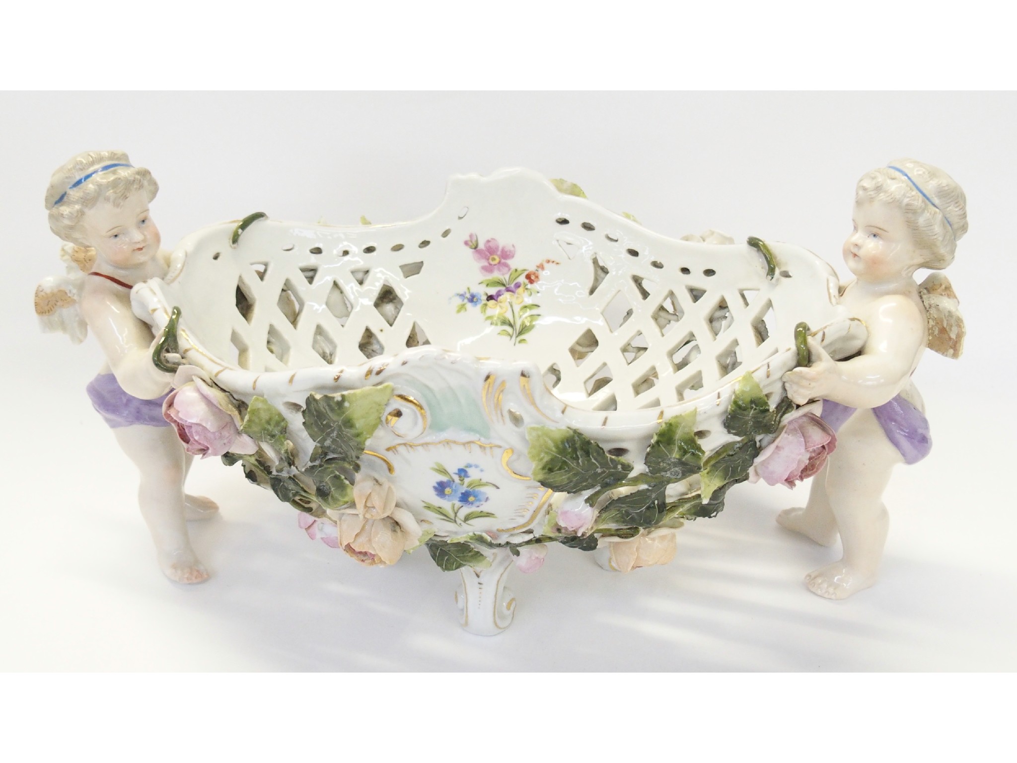 Appraisal: Continental porcelain figural reticulated footed bowl