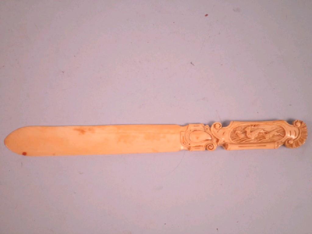 Appraisal: A late thC carved bone paper knife the handle decorated