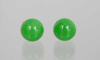 Appraisal: A Pair of Jadeite Ball Ear Studs Carved jade ball