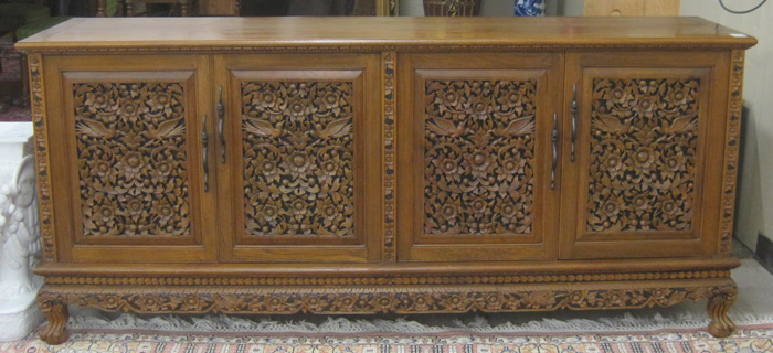 Appraisal: RELIEF-CARVED TEAKWOOD BUFFET Thailand mid th century featuring two pairs