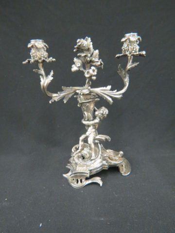 Appraisal: Silvered Bronzed Figural Candelabra child holding a cornucopia tall th