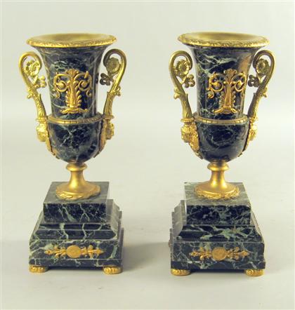 Appraisal: Pair of neoclassical style gilt metal mounted green marble urns