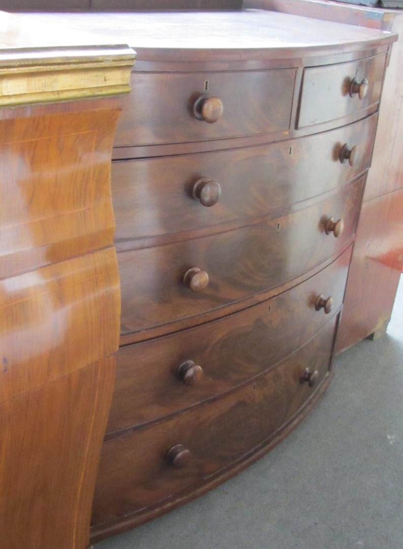 Appraisal: A Victoria mahogany bowfront chest of two short and three