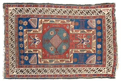 Appraisal: th century Caucasian rug cross-shaped central medallion on blue field