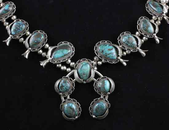 Appraisal: A native American silver and turquoise necklace with foliate bordered