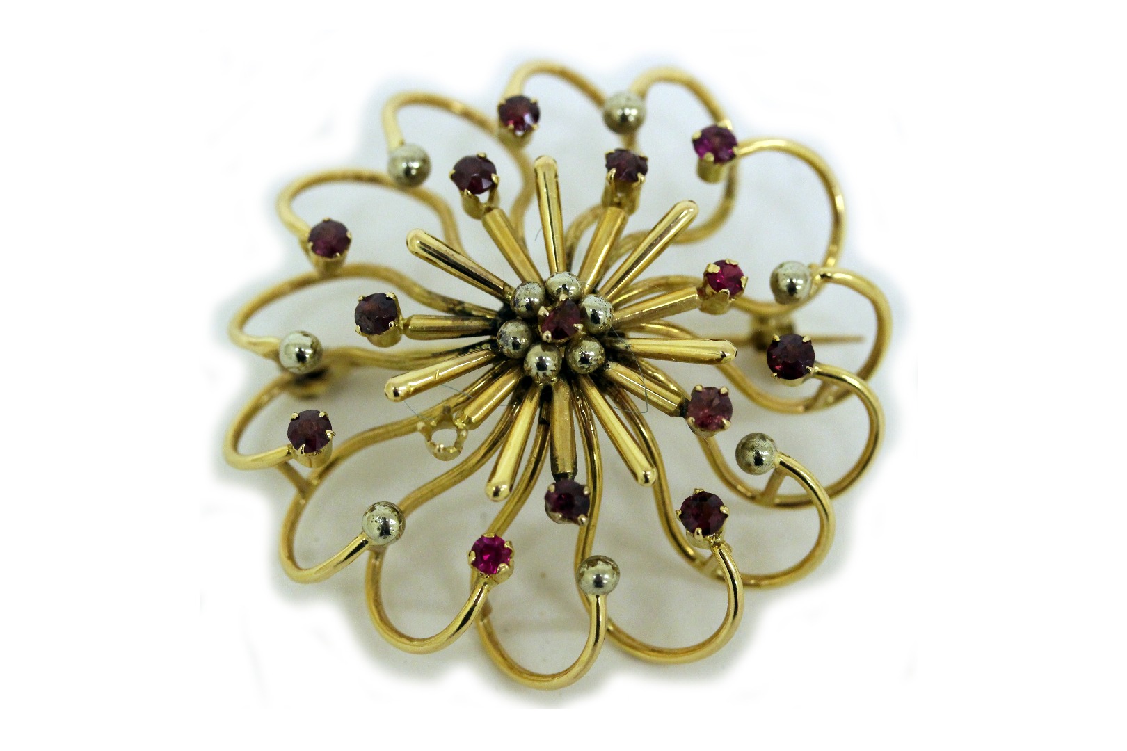 Appraisal: An Italian bi-colour gold and ruby brooch in the form