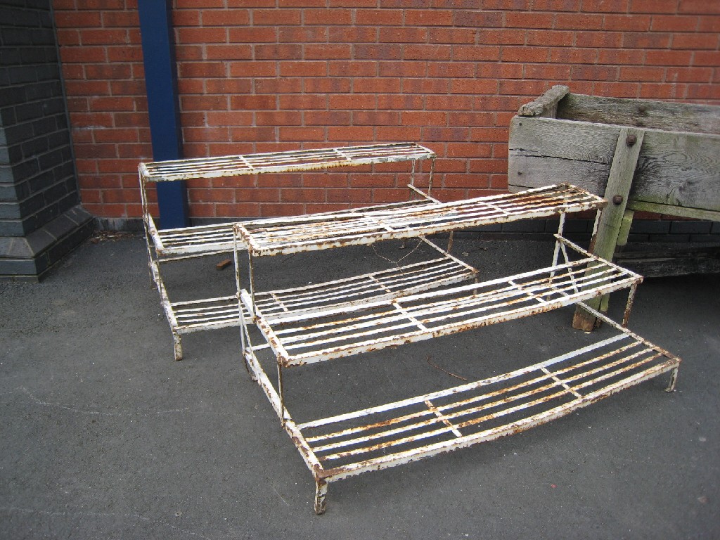 Appraisal: Pair of white painted wrought iron stepped Plant Stands