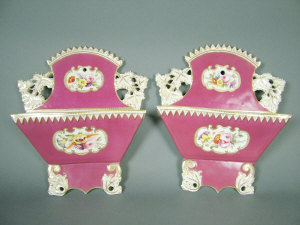 Appraisal: Pair of English porcelain wall pockets possibly Coalport dark pink