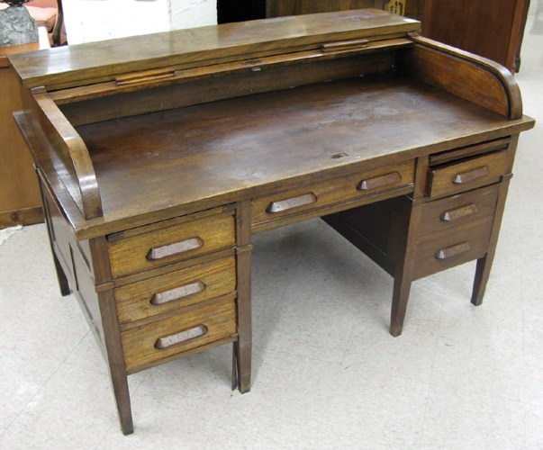 Appraisal: A MAHOGANY ROLL-TOP DESK American early th century having a