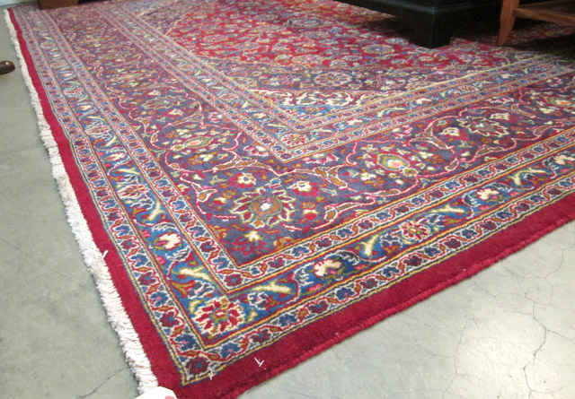 Appraisal: PERSIAN KASHAN CARPET floral and central floral medallion design on