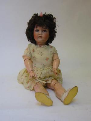 Appraisal: A Cuno Otto Dressel bisque head girl doll with blue