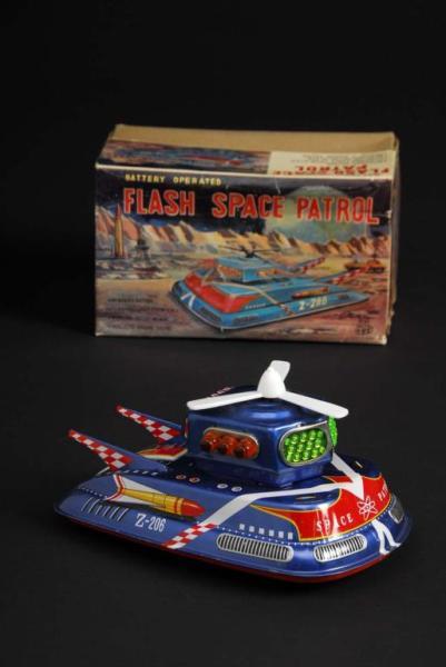 Appraisal: Tin Flash Space Patrol Battery-Operated Toy Description Japanese Made by