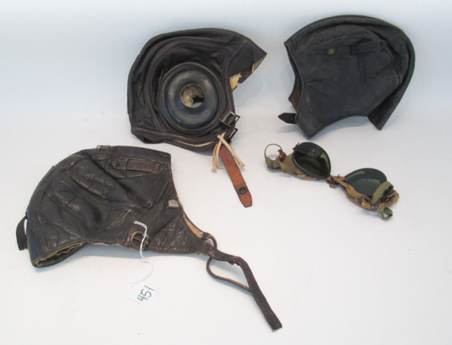 Appraisal: THREE WORLD WAR II LEATHER FLIGHT HELMETS the first a