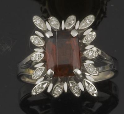 Appraisal: A garnet and diamond cluster ring in white gold French