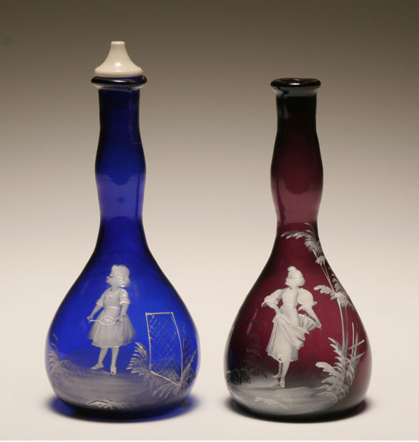 Appraisal: Pair Mary Gregory glass barber hair tonic bottles enameled scenes