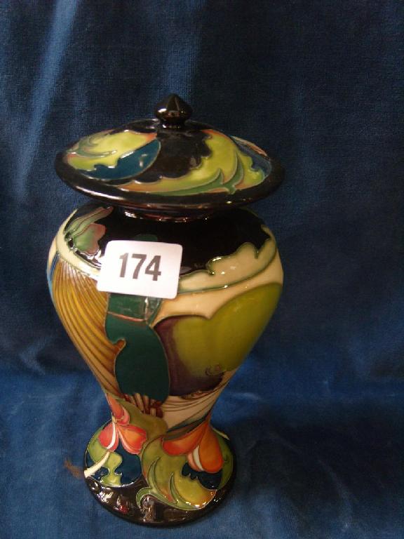 Appraisal: A Moorcroft Temple vase and cover in the Ryden Fields