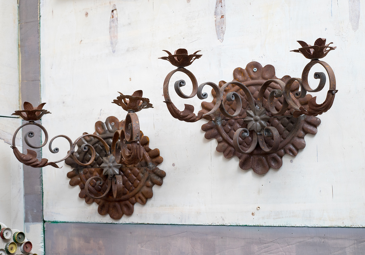 Appraisal: A PAIR OF s DECORATIVE WALL SCONCES Wrought iron floral