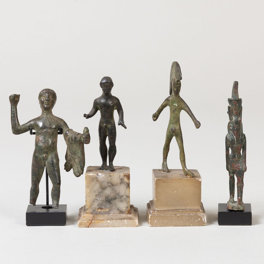 Appraisal: Group of Four Luristan and Egyptian Style Bronze Figures Each