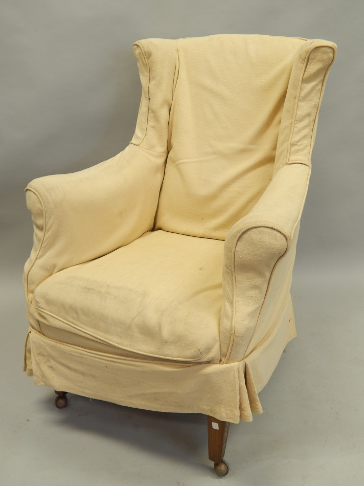 Appraisal: A late thC early thC mahogany wingback chair with gold