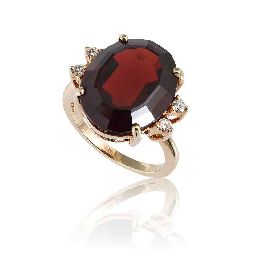 Appraisal: CT MOZAMBIQUE GARNET RING WITH DIAMONDS K yellow gold ring