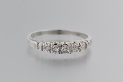 Appraisal: A Platinum and Diamond Band Platinum band set across the