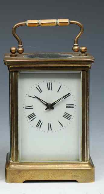 Appraisal: A FRENCH BRASS CASED CARRIAGE TIMEPIECE with white enamel Roman