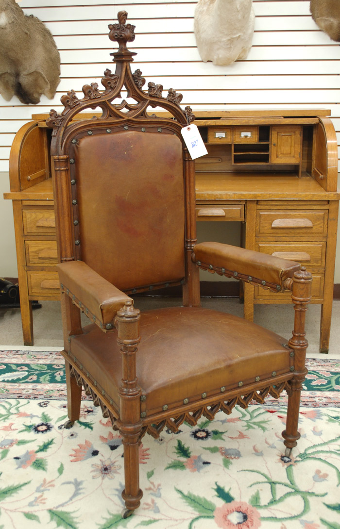 Appraisal: CARVED OAK AND BROWN LEATHER ARMCHAIR Gothic Revival English c