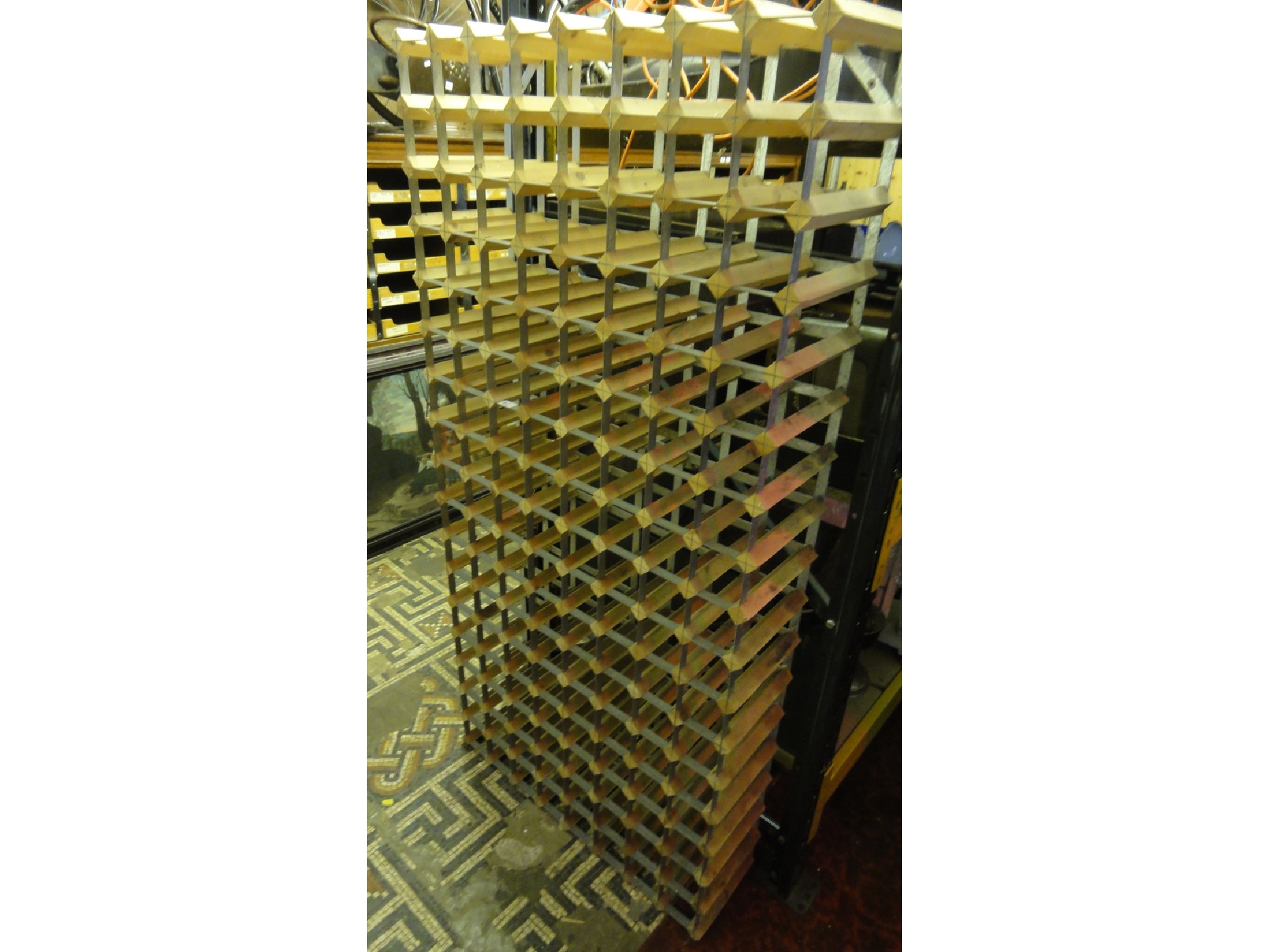 Appraisal: A contemporary steel bound and pine divisional wine rack to