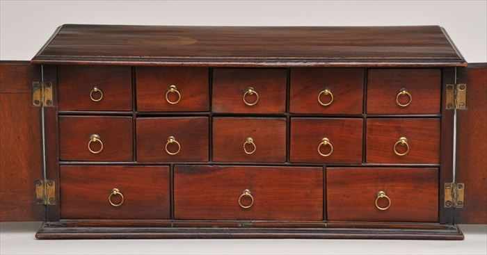 Appraisal: GEORGE III INLAID MAHOGANY TWO-FRONTED SPECIMEN CABINET Each front enclosed