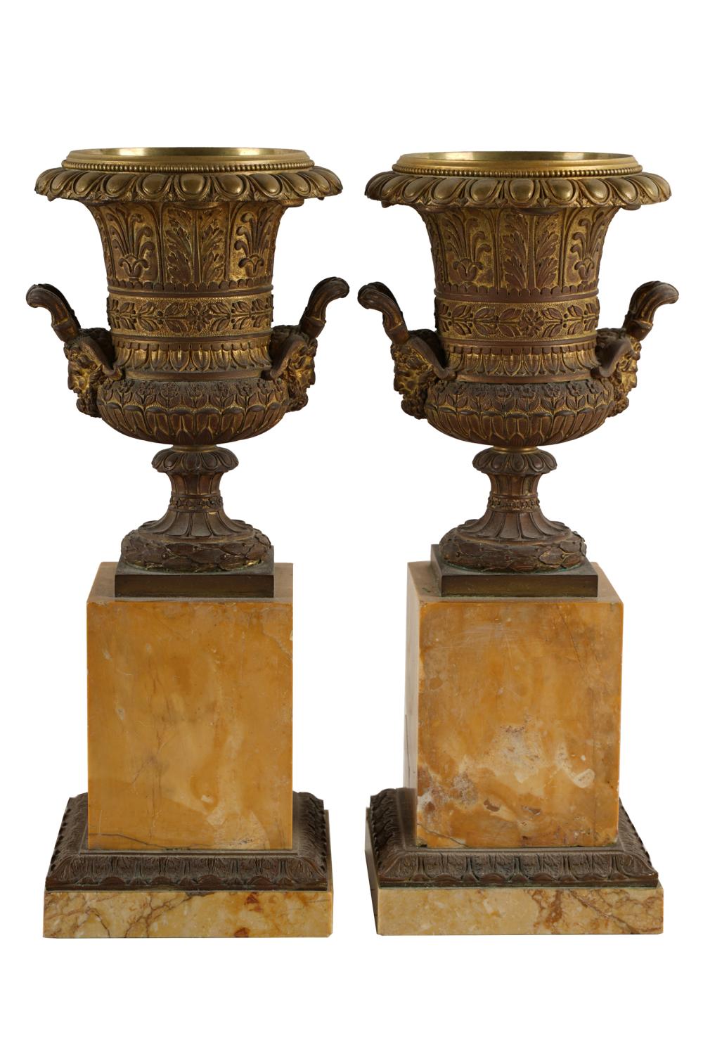 Appraisal: PAIR OF BRONZE URNSon marble bases Condition with oxidation to