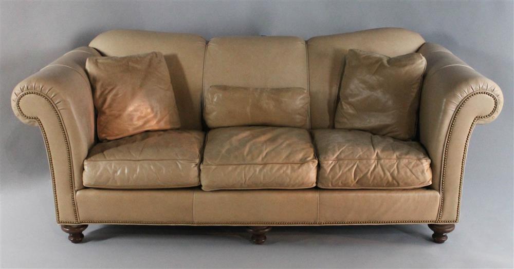 Appraisal: SOUTHWOOD TAN CONTEMPORARY LEATHER SOFA having a channel stitched tight