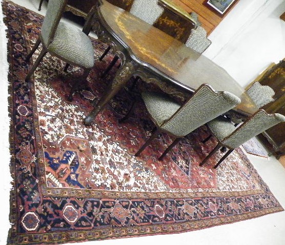 Appraisal: PERSIAN HERIZ CARPET overall stylized floral decorated central cruciform medallion