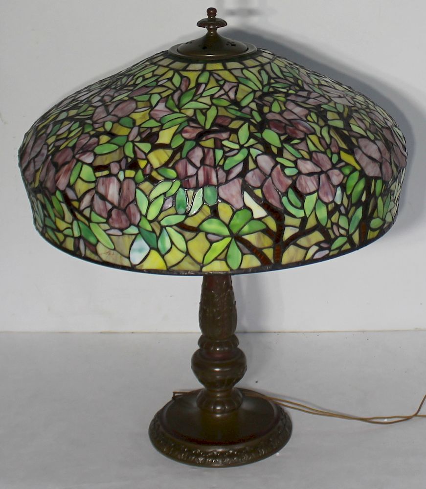 Appraisal: HANDEL Gilt Metal Table Lamp And Leaded Shade An enameled