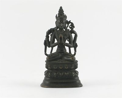 Appraisal: A Tibetan bronze seated figure of Sadaksari raised on a